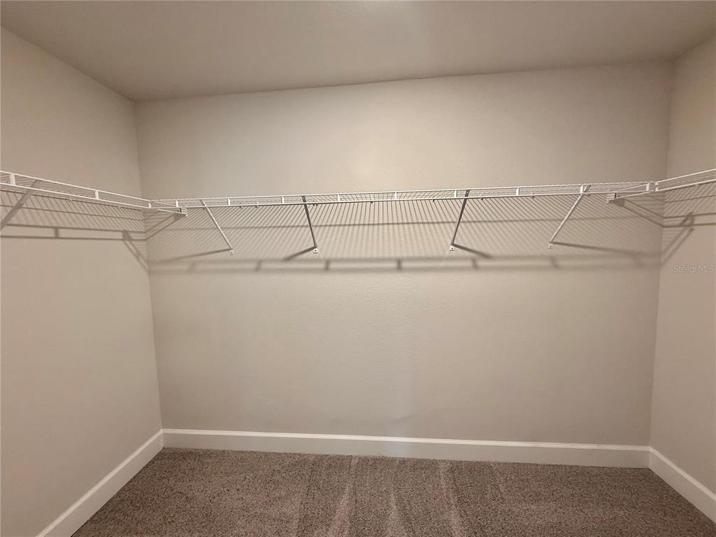 135 Hardee Way Rotonda West, FL 33947 - Photo 18 of 30 a view of a room with racks on the wall