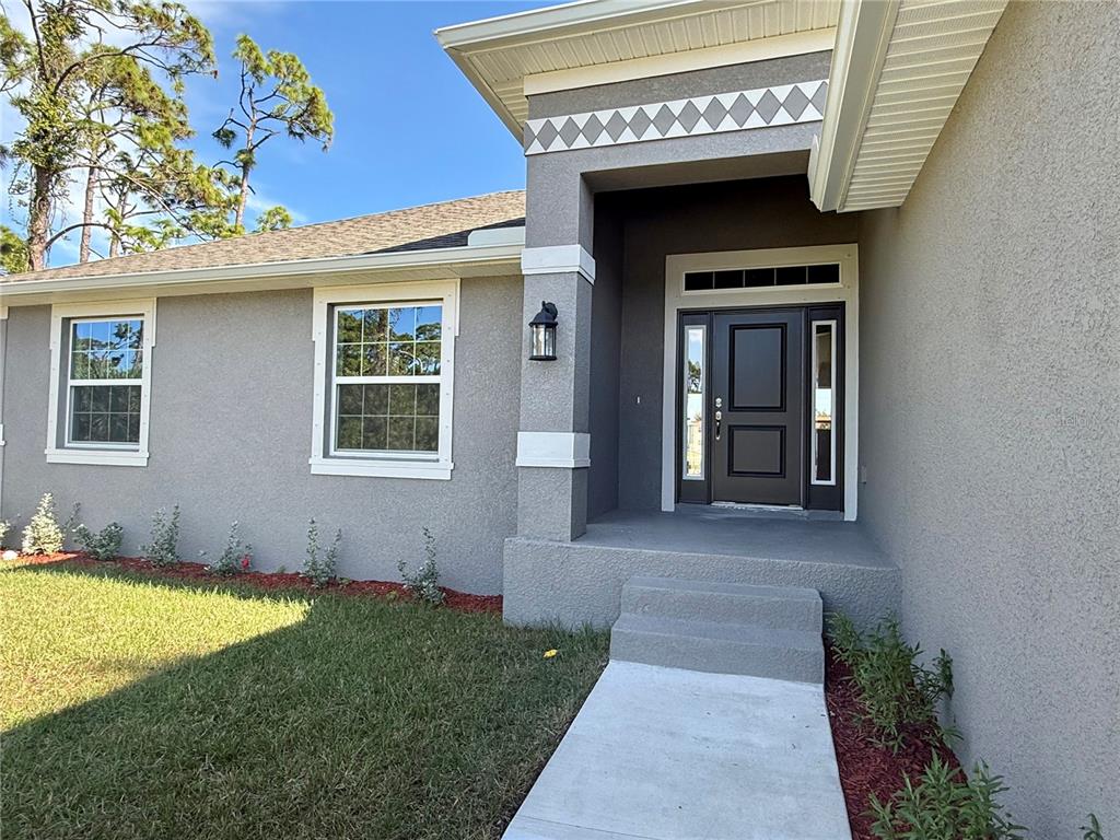 135 Hardee Way Rotonda West, FL 33947 - Photo 3 of 30 a view of an entrance of the house