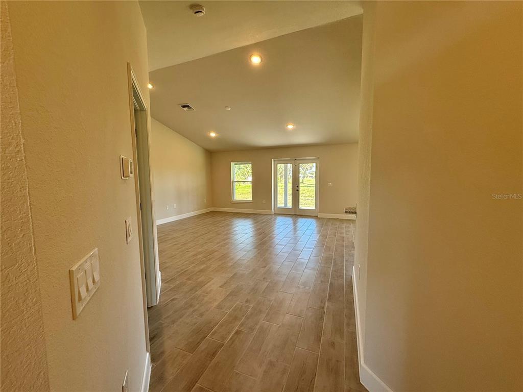 135 Hardee Way Rotonda West, FL 33947 - Photo 4 of 30 a view of livingroom and hardwood
