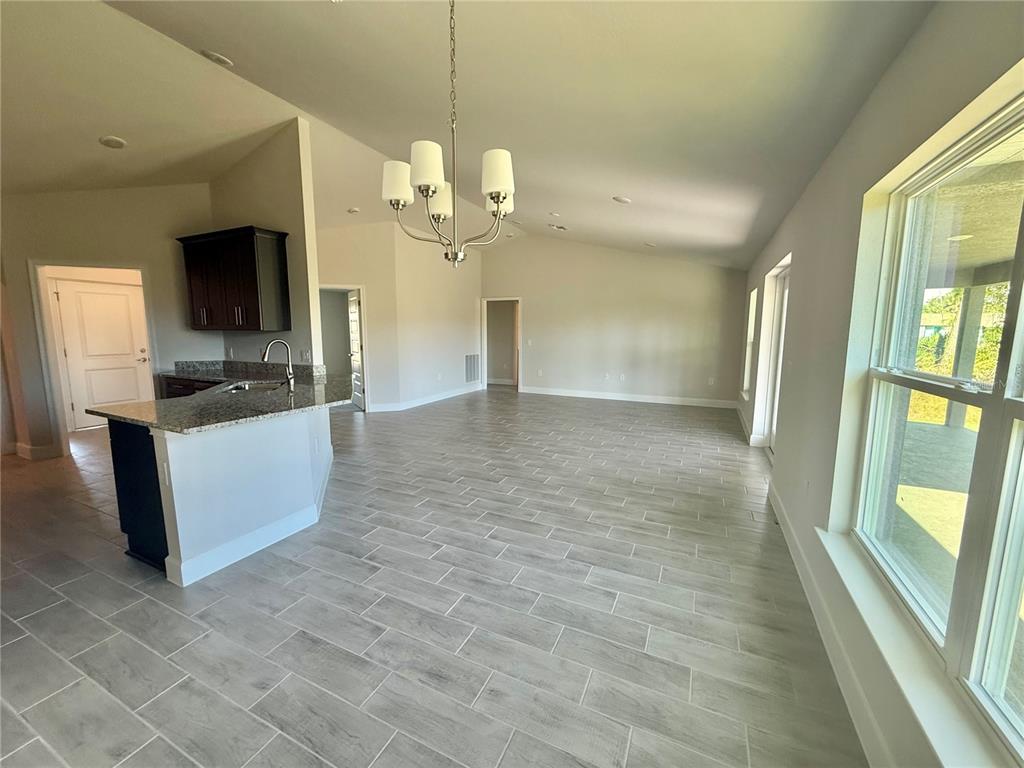 135 Hardee Way Rotonda West, FL 33947 - Photo 9 of 30 a view of a kitchen with a sink and a kitchen view