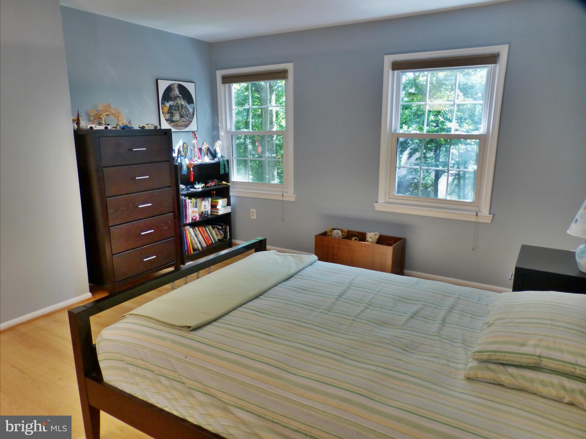 1866 Post Oak Trail Reston, VA 20191 - Photo 12 of 19 a bedroom with a bed and a window