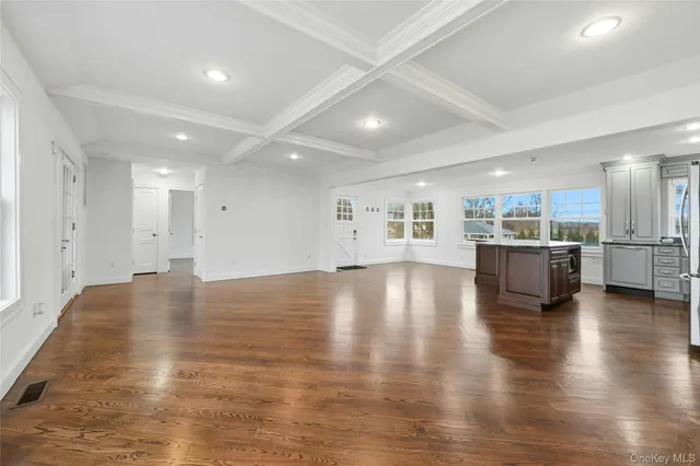a view of a kitchen with kitchen island and a hard wood floor