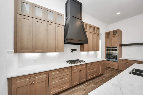 a kitchen with a counter space a sink and appliances
