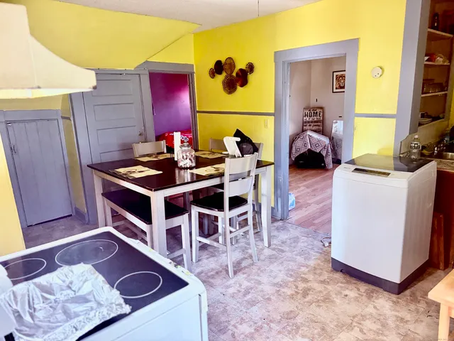 a living room with furniture a rug and a fireplace