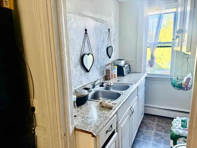 a kitchen with a sink and a window