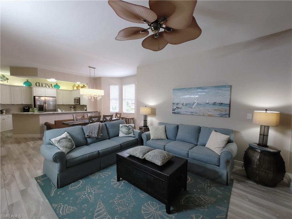 400 Flagship Drive, Unit 501 Naples, FL 34108 - Photo 15 of 38 a living room with furniture and a wooden floor
