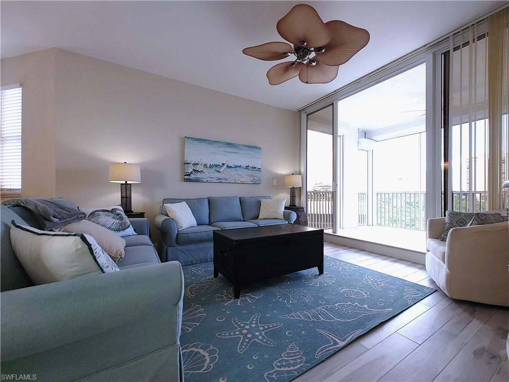 400 Flagship Drive, Unit 501 Naples, FL 34108 - Photo 16 of 38 a living room with furniture and a large window
