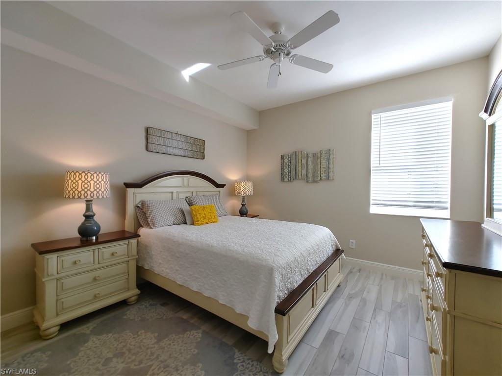 400 Flagship Drive, Unit 501 Naples, FL 34108 - Photo 22 of 38 a bedroom with bed and window