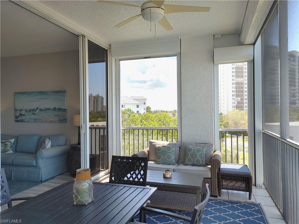 400 Flagship Drive, Unit 501 Naples, FL 34108 - Photo 26 of 38 a living room with furniture and a large window