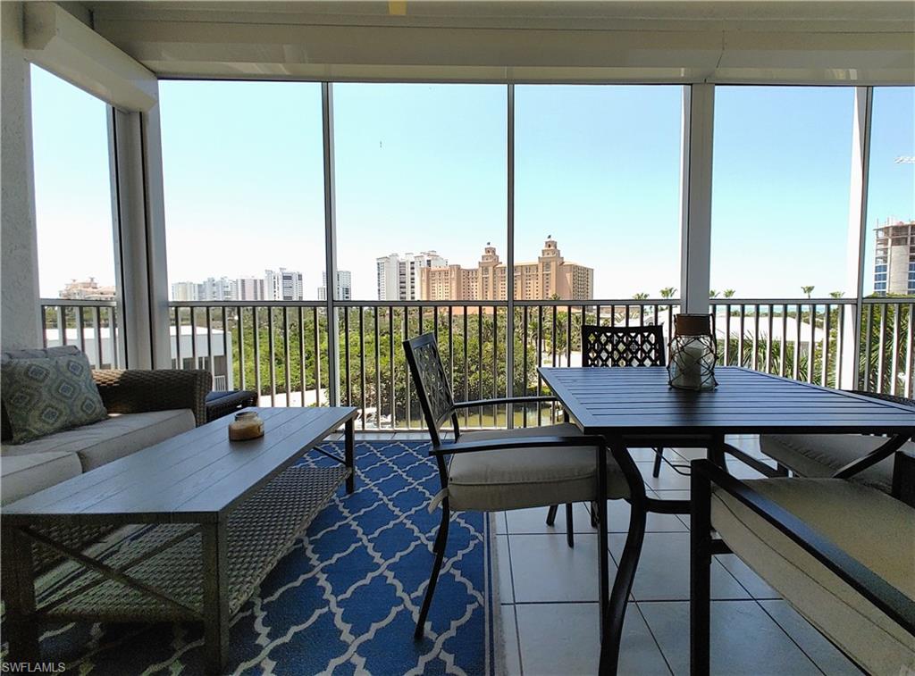 400 Flagship Drive, Unit 501 Naples, FL 34108 - Photo 28 of 38 a view of a dining room with furniture and window in it