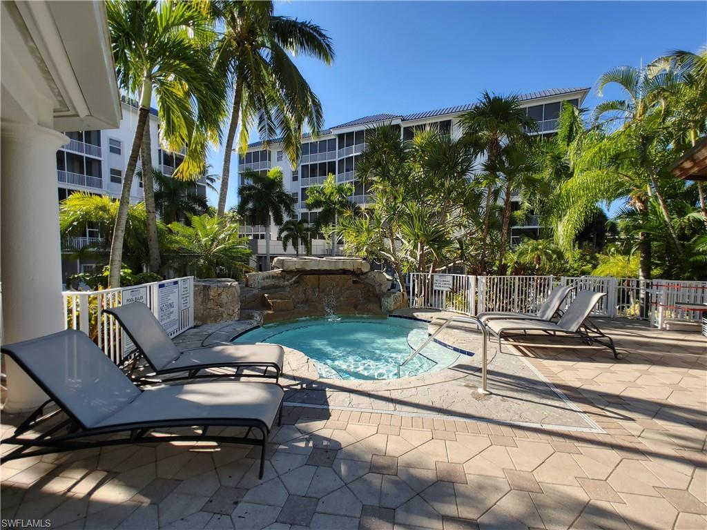 400 Flagship Drive, Unit 501 Naples, FL 34108 - Photo 31 of 38 a view of a backyard with sitting area