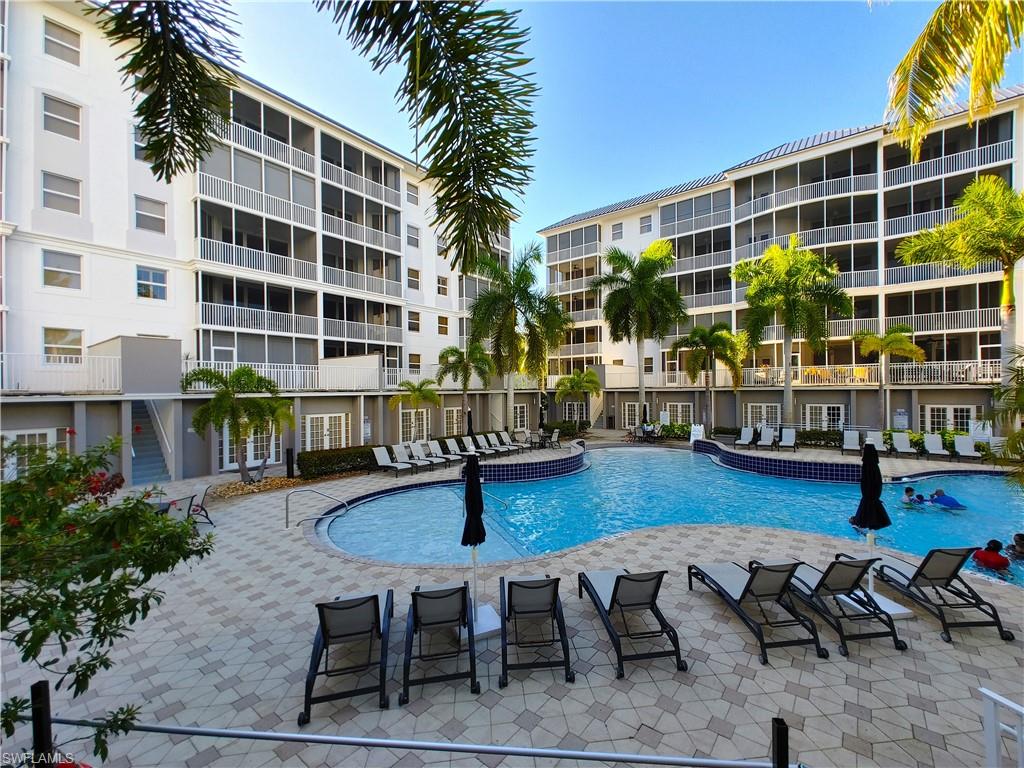400 Flagship Drive, Unit 501 Naples, FL 34108 - Photo 33 of 38 a front view of building with outdoor seating