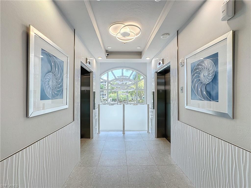 400 Flagship Drive, Unit 501 Naples, FL 34108 - Photo 6 of 38 a view of entryway with wooden floor