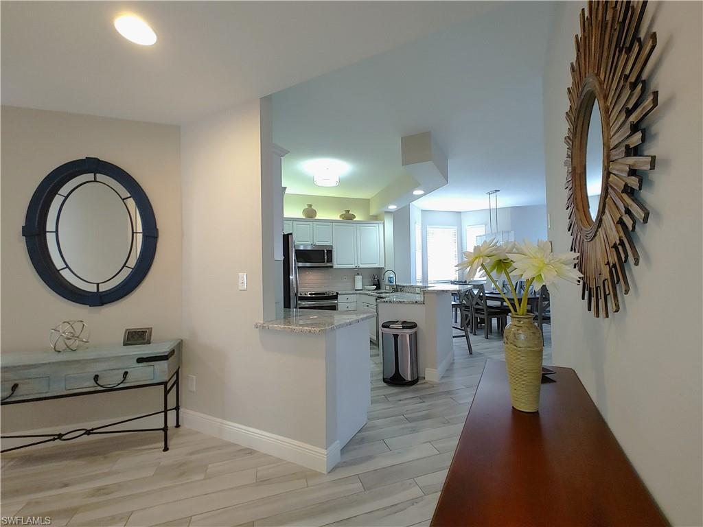 400 Flagship Drive, Unit 501 Naples, FL 34108 - Photo 7 of 38 a view of a living room and dining room