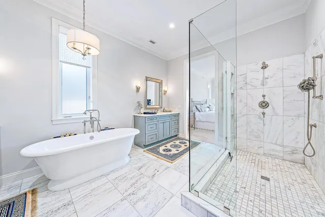 a spacious bathroom with a sink a toilet a shower a mirror and bathtub