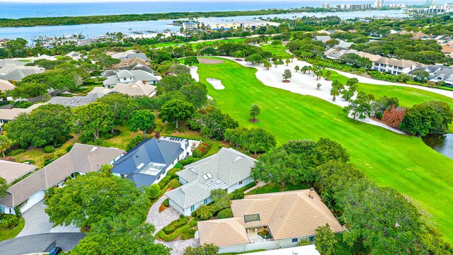 an aerial view of residential houses with outdoor space and street view