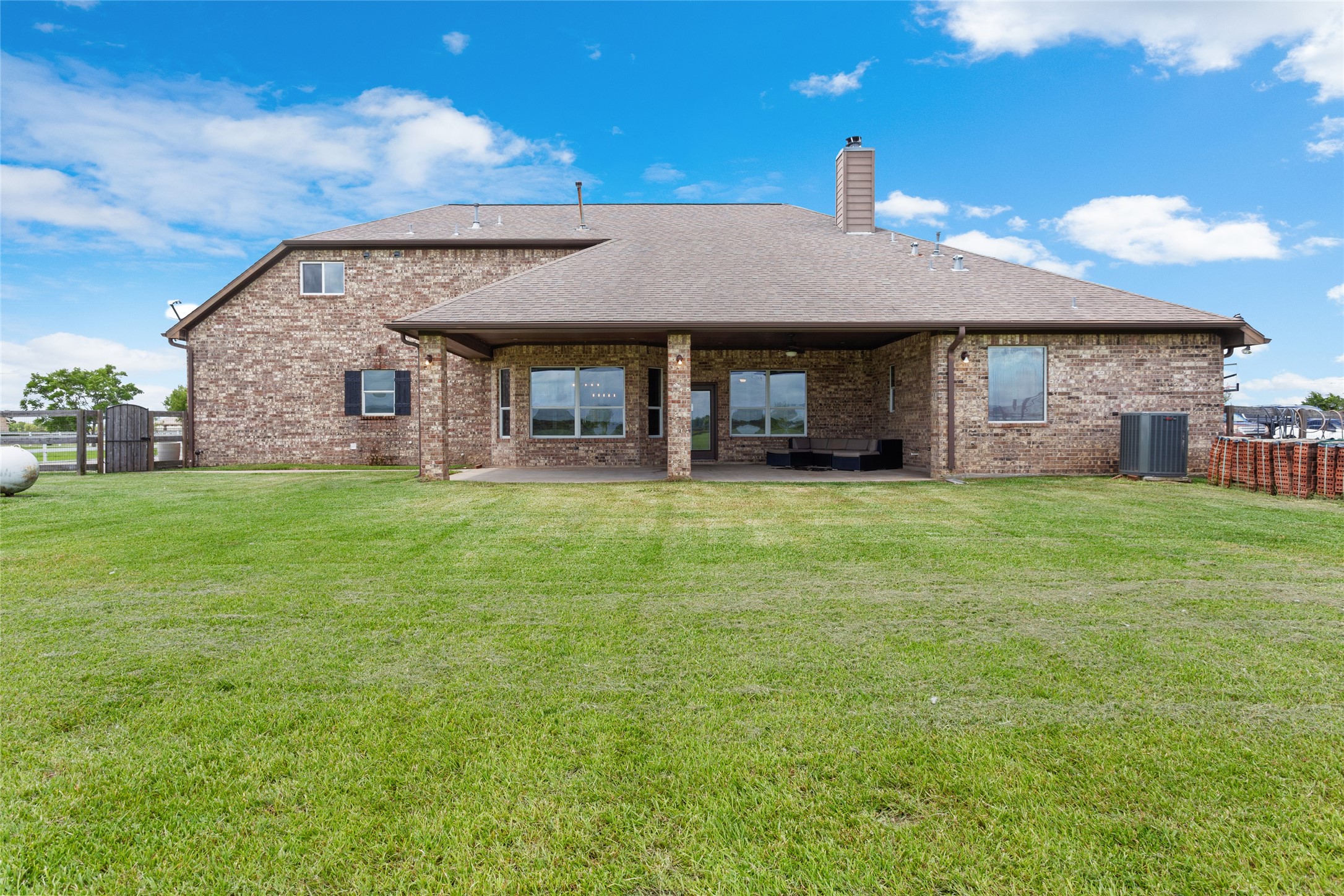 7842 Pebble Hill Lane Rosharon, TX 77583 - Photo 31 of 33 a view of a house with a yard