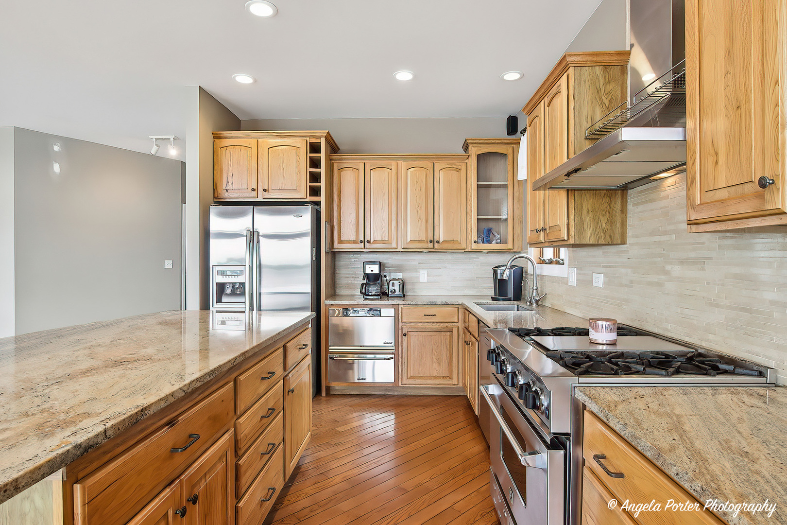 35166 Lake Shore Road Ingleside, IL 60041 - Photo 15 of 39 a kitchen with stainless steel appliances granite countertop a stove a sink and a refrigerator
