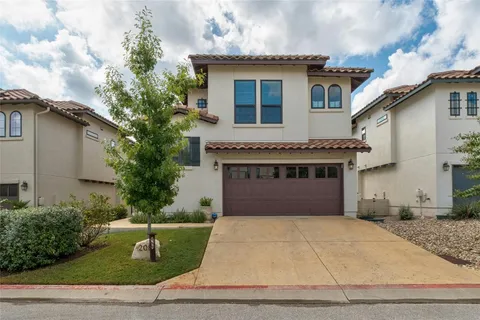 a front view of a house with garage