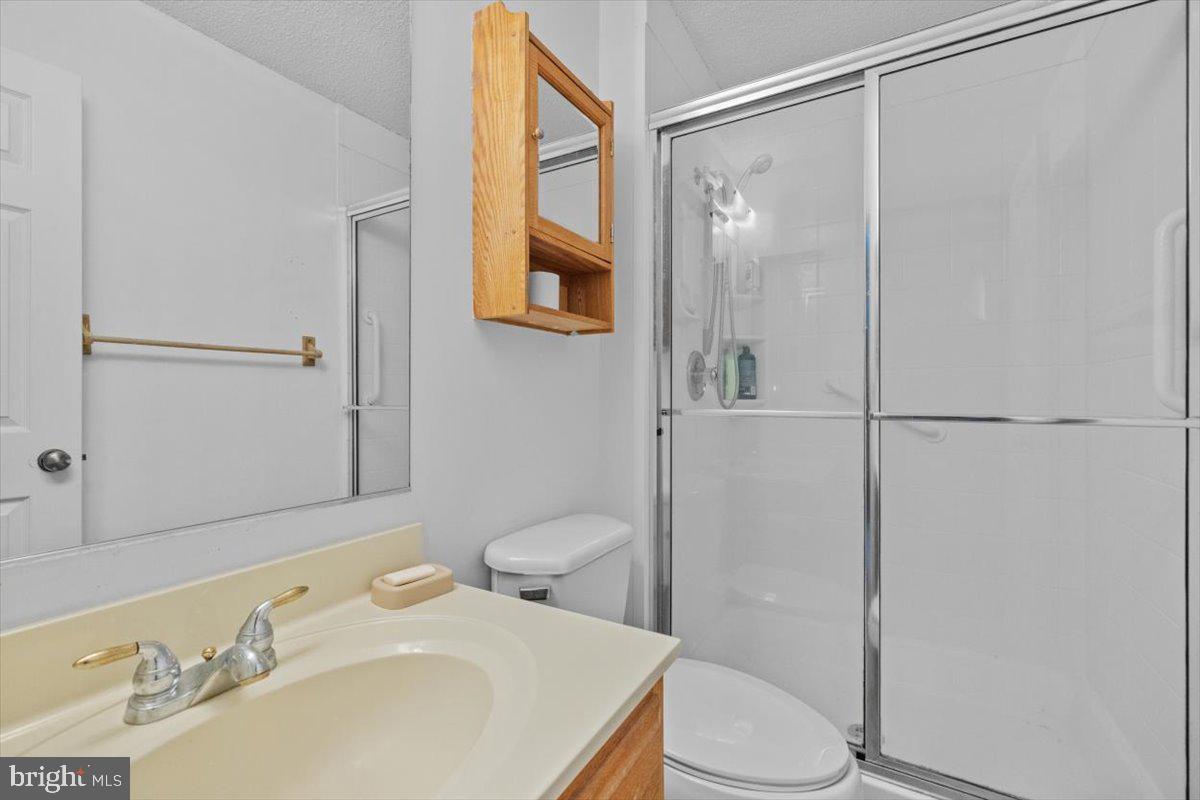 115 Indian Hills Road Locust Grove, VA 22508 - Photo 11 of 20 a bathroom with a sink toilet and shower