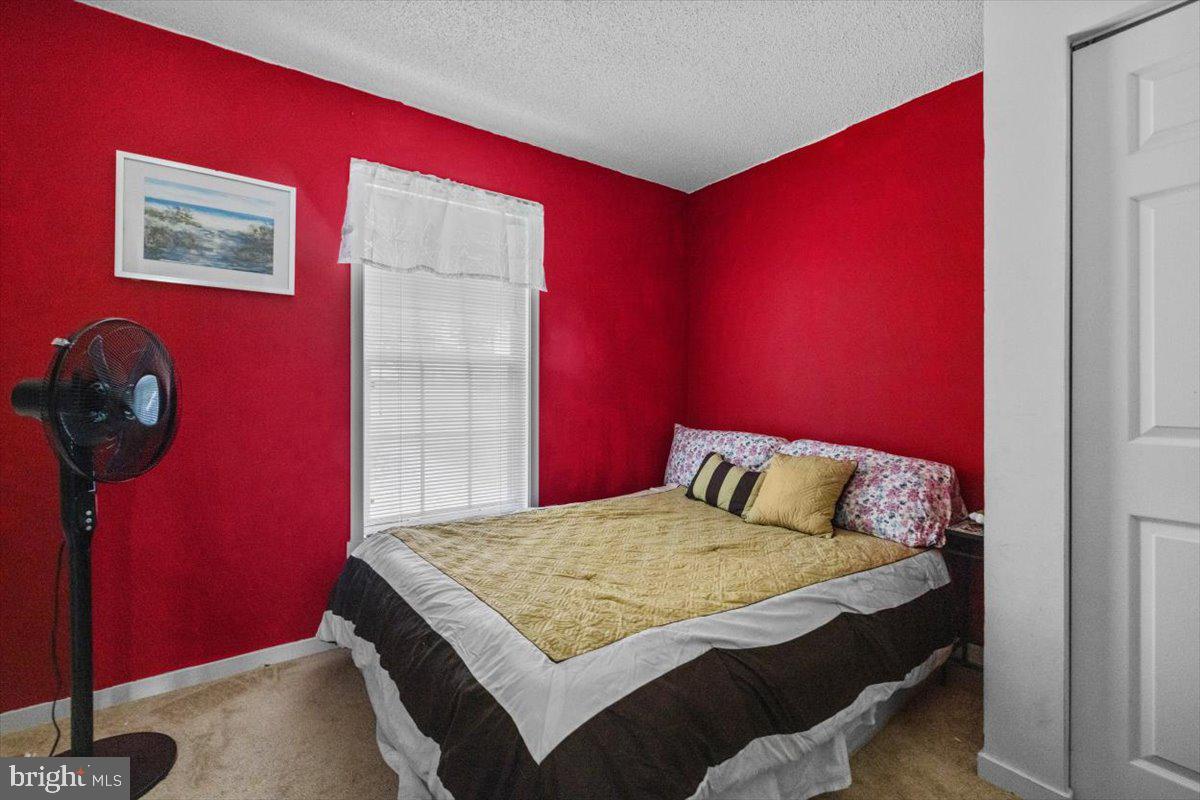 115 Indian Hills Road Locust Grove, VA 22508 - Photo 13 of 20 a bedroom with a bed and a window