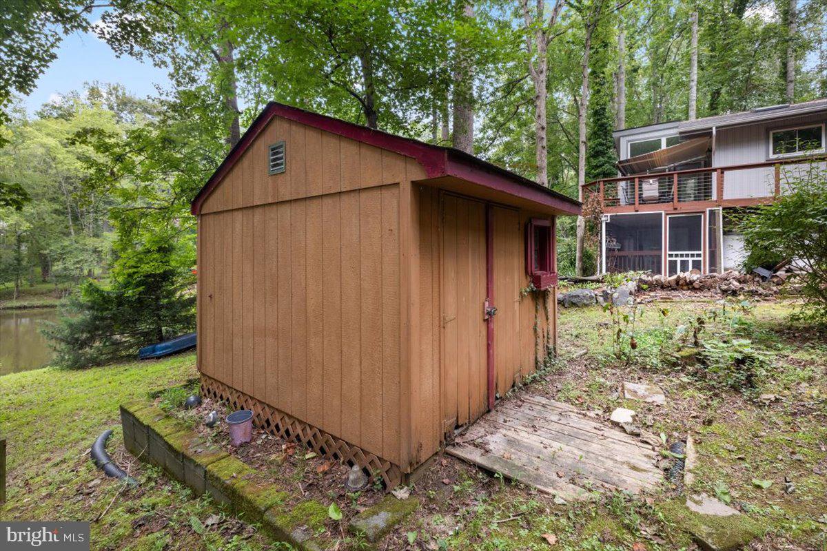 115 Indian Hills Road Locust Grove, VA 22508 - Photo 19 of 20 a backyard of a house with seating space
