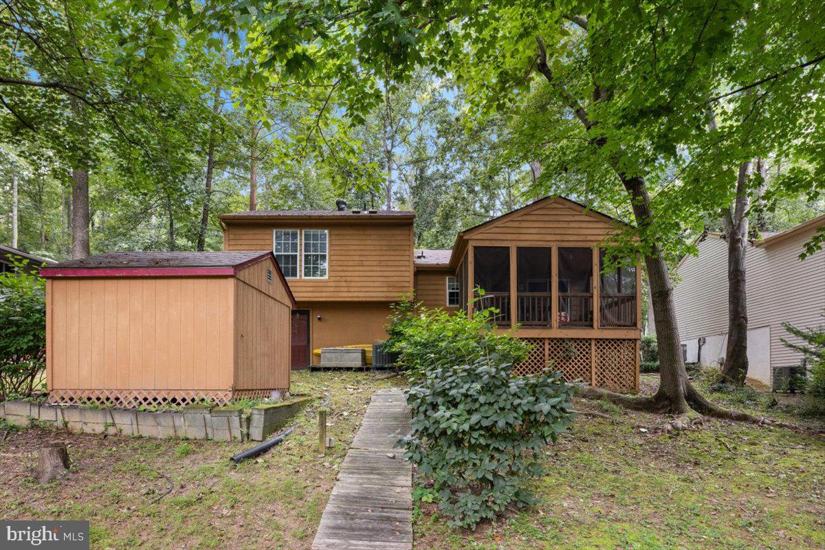 115 Indian Hills Road Locust Grove, VA 22508 - Photo 20 of 20 a front view of a house with garden