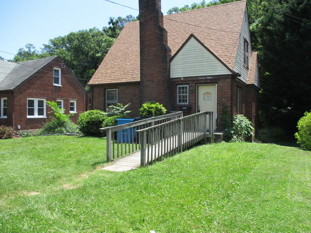 1430 Main Street Southwest Roanoke, VA 24015 - Photo 1 of 21 a front view of a house with yard and green space