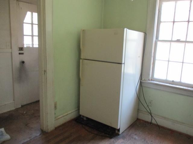 1430 Main Street Southwest Roanoke, VA 24015 - Photo 14 of 21 a view of kitchen with a refrigerator wooden floor and window