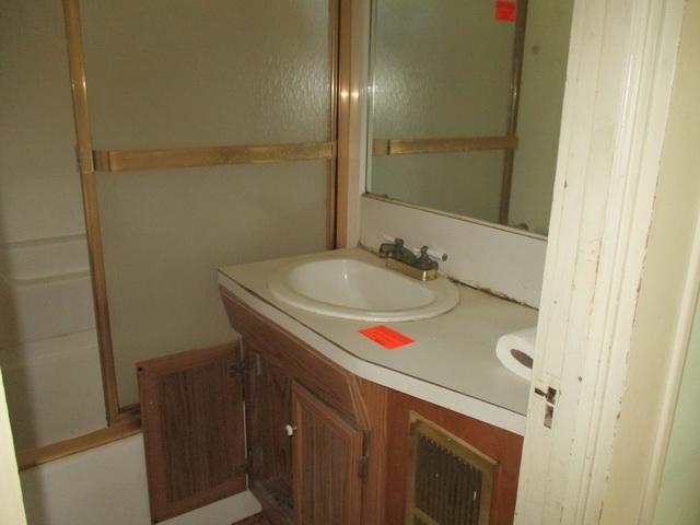 1430 Main Street Southwest Roanoke, VA 24015 - Photo 15 of 21 a bathroom with a sink and a mirror
