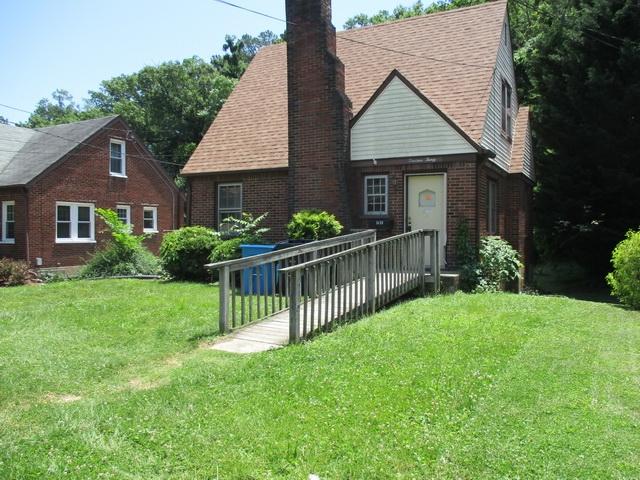 1430 Main Street Southwest Roanoke, VA 24015 - Photo 4 of 21 a front view of a house with yard and green space