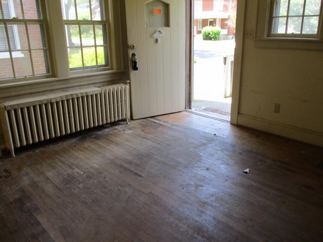 1430 Main Street Southwest Roanoke, VA 24015 - Photo 7 of 21 an empty room with wooden floor and windows