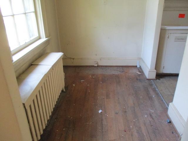 1430 Main Street Southwest Roanoke, VA 24015 - Photo 8 of 21 a view of a hallway with wooden floor and staircase
