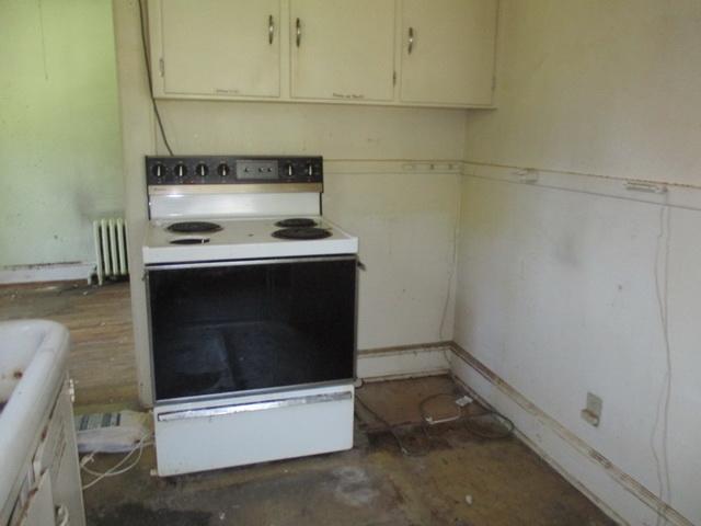 1430 Main Street Southwest Roanoke, VA 24015 - Photo 10 of 21 a stove top oven sitting inside of a kitchen