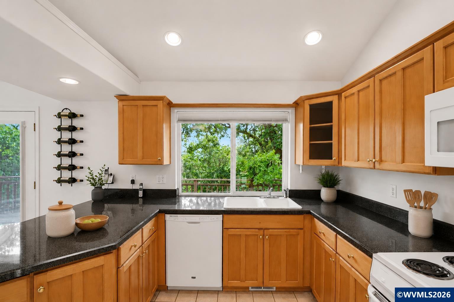 1299 Twin Hills Road Southeast Jefferson, OR 97352 - Photo 19 of 47 a kitchen with sink a window and cabinets