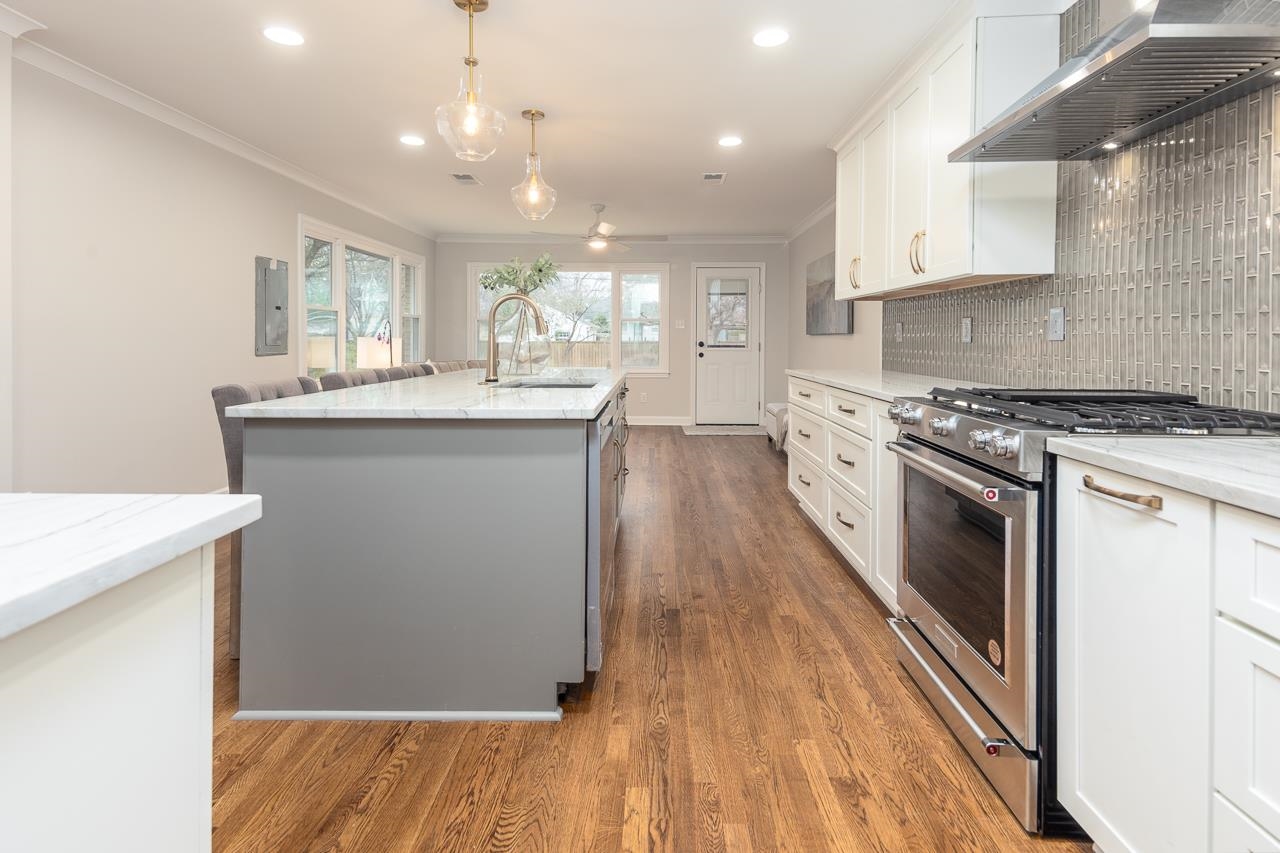 1156 Marcia Road Memphis, TN 38117 - Photo 8 of 40 a kitchen with a sink stove and cabinets