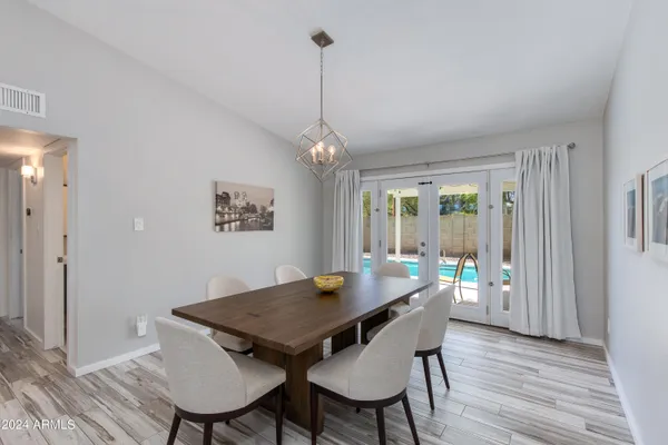 a view of a dining room with furniture window and wooden floor