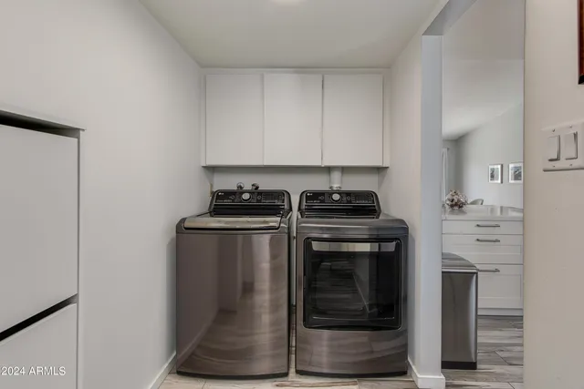 a kitchen with stainless steel appliances granite countertop a stove and a refrigerator