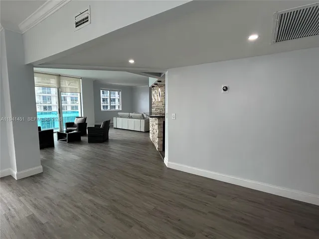 a view of a livingroom with furniture and wooden floor