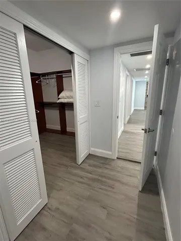 wooden floor in a hall with an entryway