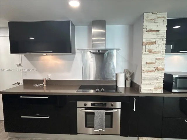a kitchen with a sink and a stove