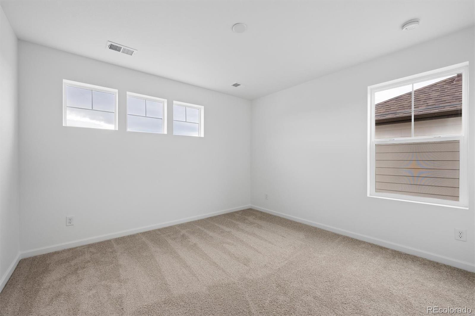 424 South Rifle Street Aurora, CO 80017 - Photo 15 of 23 a view of an empty room with a window
