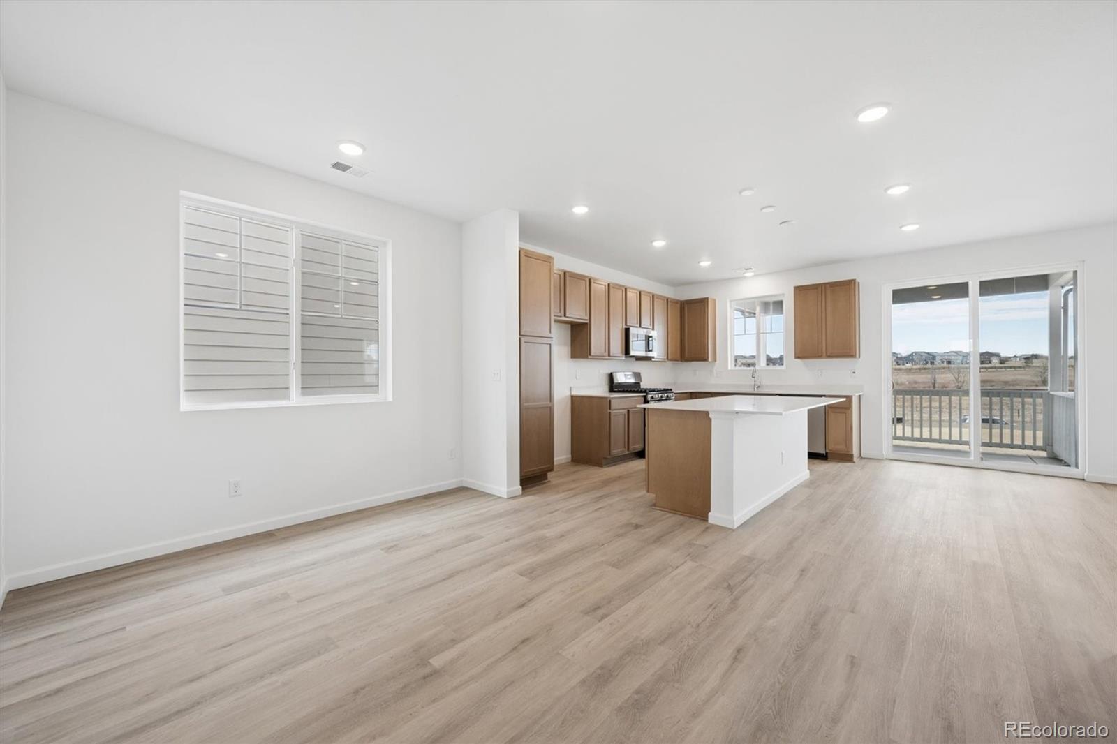 424 South Rifle Street Aurora, CO 80017 - Photo 4 of 23 a view of kitchen with granite countertop cabinets and refrigerator