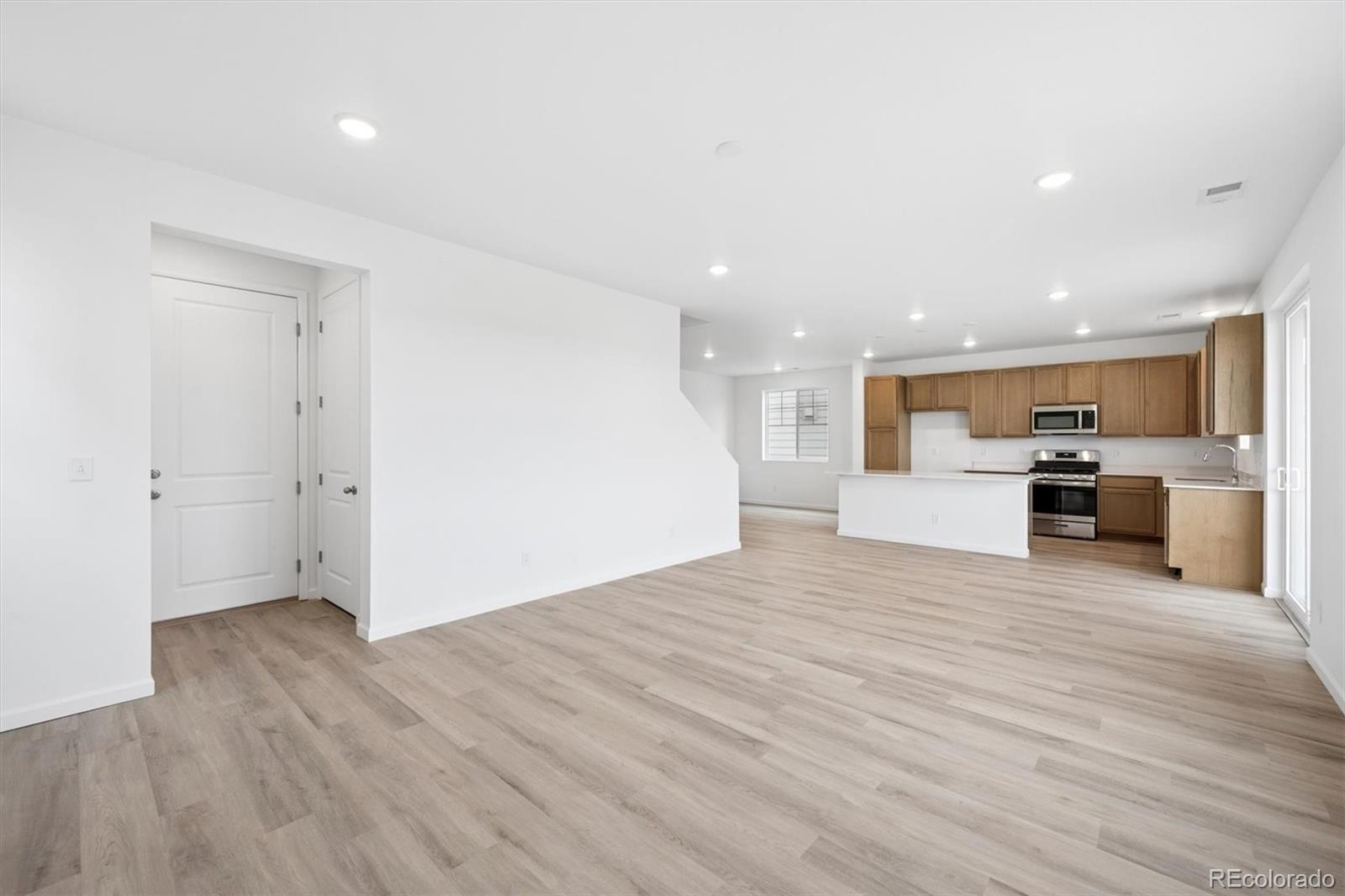 424 South Rifle Street Aurora, CO 80017 - Photo 9 of 23 a view of kitchen with stainless steel appliances refrigerator microwave and stove