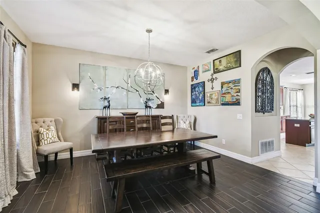 a large kitchen with stainless steel appliances kitchen island granite countertop a large counter top and stove