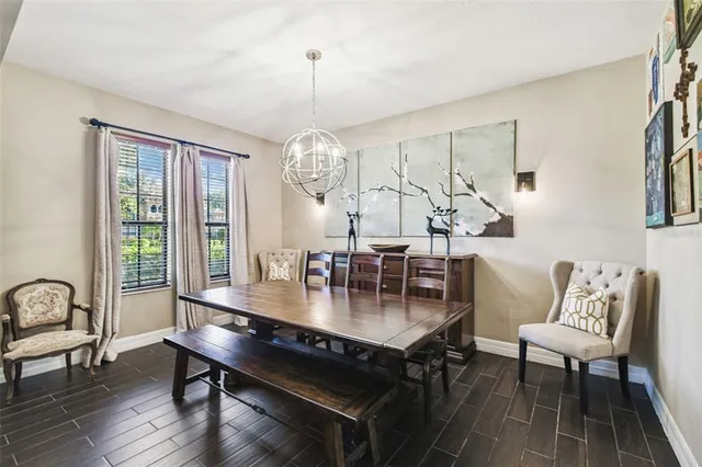 a living room with a large window and a table