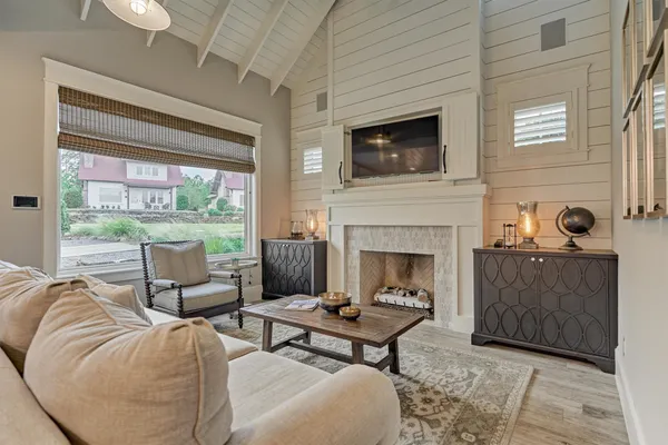 a living room with furniture and a fireplace