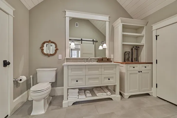 a view of a hallway with a glass door and closet
