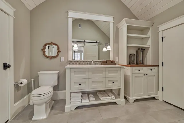 a view of a hall with a floor to ceiling window and wooden floor