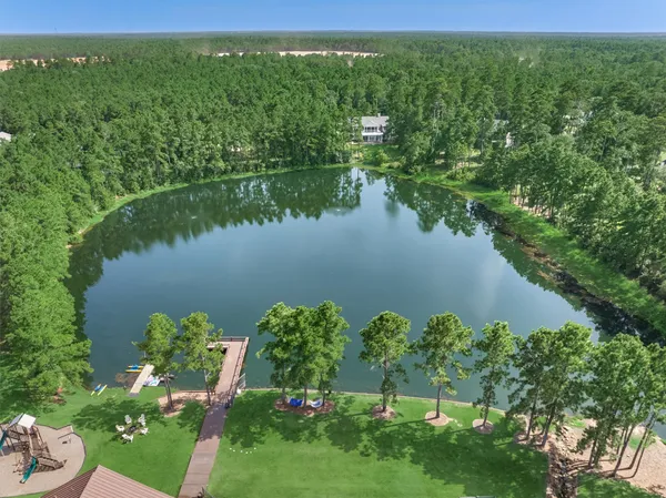 a view of a wooden deck and lake view